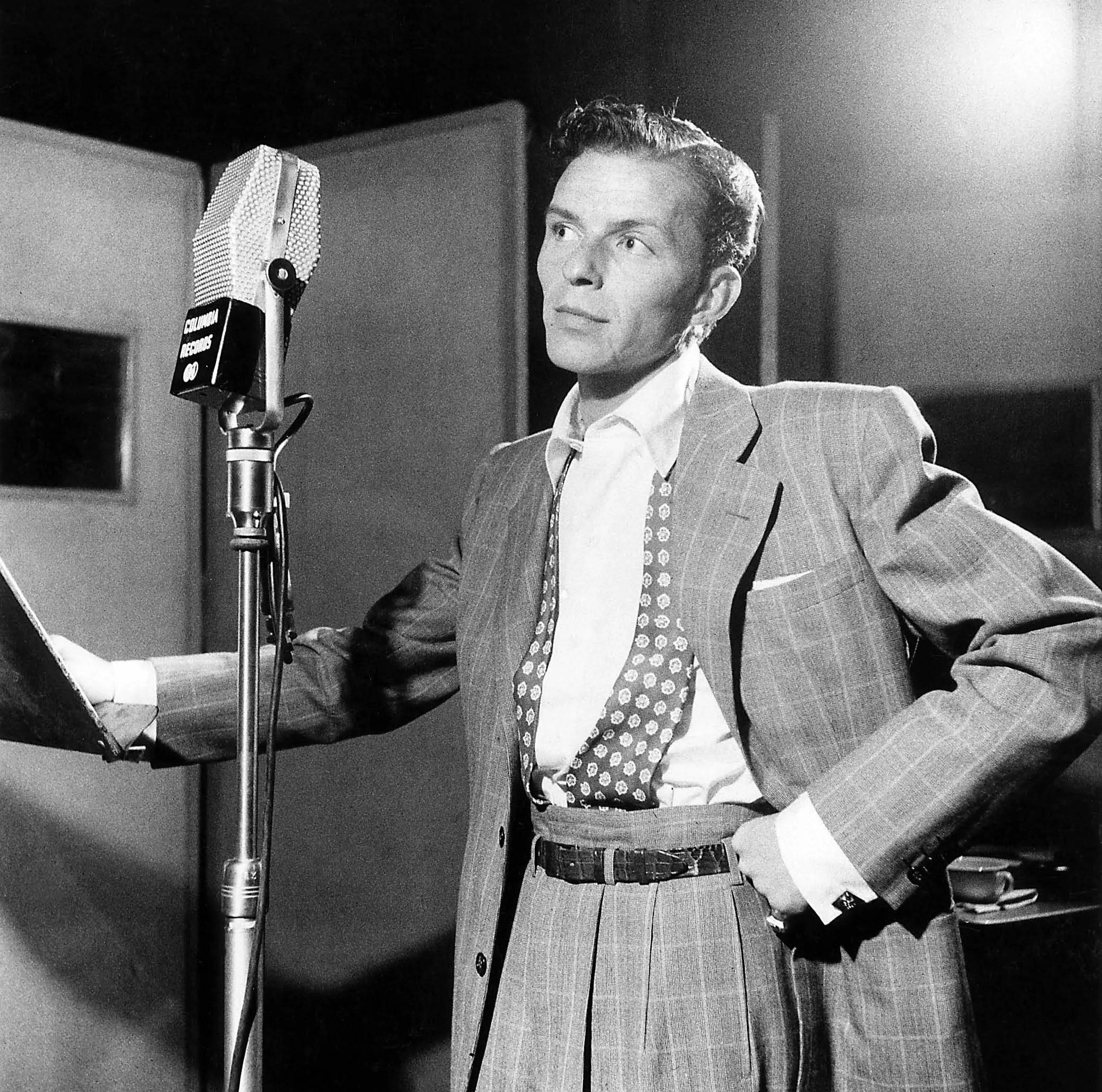 Photo of Frank SINATRA; posed, next to microphone, recording at Columbia Recording studios, Liederkrantz Hall